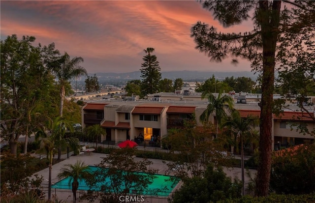 9418 Via Patricia Unit 30, Burbank, CA 91504 - back of house at dusk featuring stucco siding and a patio