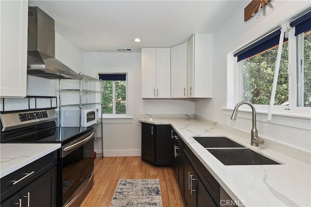582 Sunset View Rd, Twin Peaks, CA 92391 - kitchen featuring stainless steel electric stove, wall chimney exhaust hood, white cabinets, dark cabinets, and recessed lighting