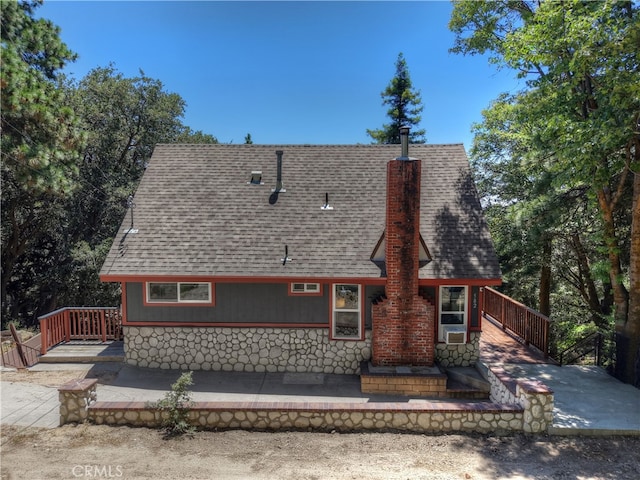582 Sunset View Rd, Twin Peaks, CA 92391 - rear view of property with roof with shingles, stone siding, and a deck
