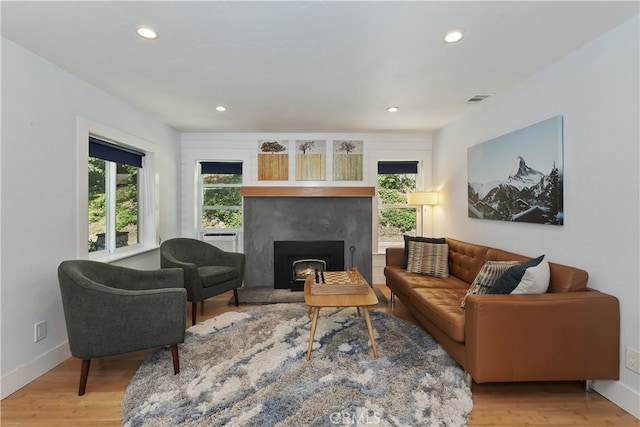 582 Sunset View Rd, Twin Peaks, CA 92391 - living room with recessed lighting, light wood finished floors, a fireplace, and cooling unit