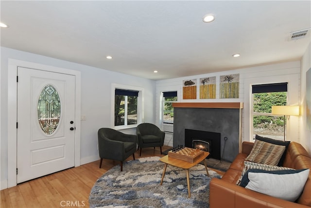 582 Sunset View Rd, Twin Peaks, CA 92391 - living room featuring light wood-type flooring, recessed lighting, a lit fireplace, and cooling unit