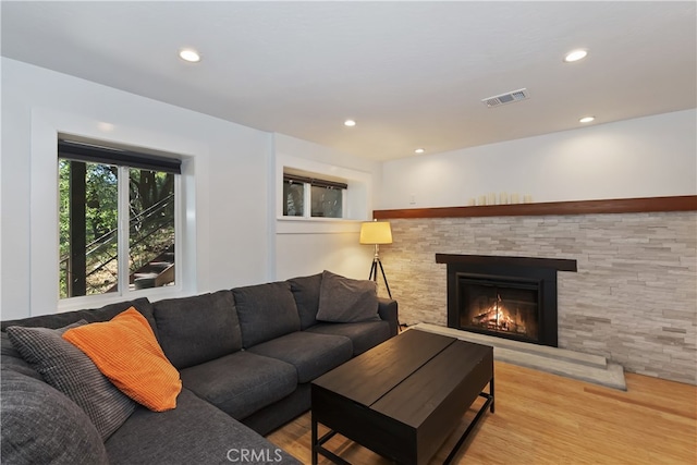 582 Sunset View Rd, Twin Peaks, CA 92391 - living area with wood finished floors, recessed lighting, and a glass covered fireplace