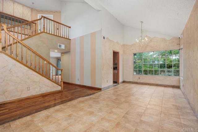 4556 Mariners Bay, Oceanside, CA 92057 - empty room featuring a chandelier, stairs, and high vaulted ceiling