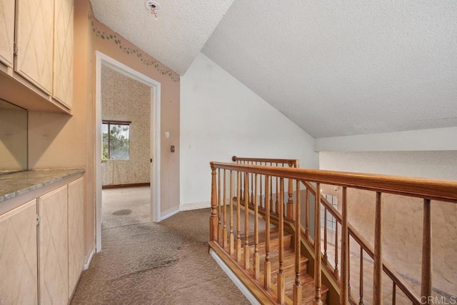 4556 Mariners Bay, Oceanside, CA 92057 - hall with a textured ceiling, light colored carpet, lofted ceiling, and an upstairs landing