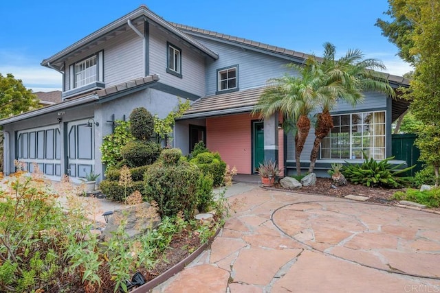 4556 Mariners Bay, Oceanside, CA 92057 - view of front of house featuring a tiled roof and a patio area
