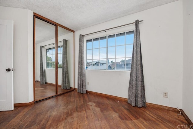 4556 Mariners Bay, Oceanside, CA 92057 - spare room with wood finished floors and a textured ceiling