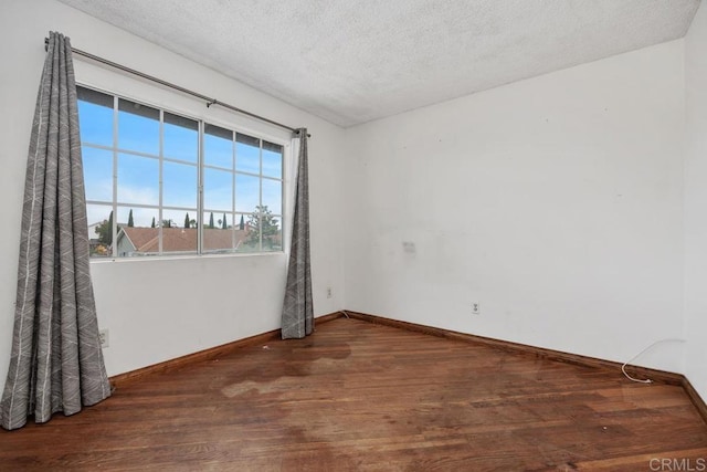 4556 Mariners Bay, Oceanside, CA 92057 - unfurnished room with wood finished floors and a textured ceiling