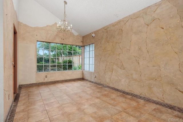 4556 Mariners Bay, Oceanside, CA 92057 - spare room featuring vaulted ceiling, a chandelier, and a textured ceiling