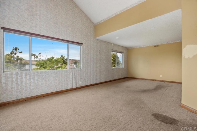 4556 Mariners Bay, Oceanside, CA 92057 - carpeted empty room with vaulted ceiling and wallpapered walls