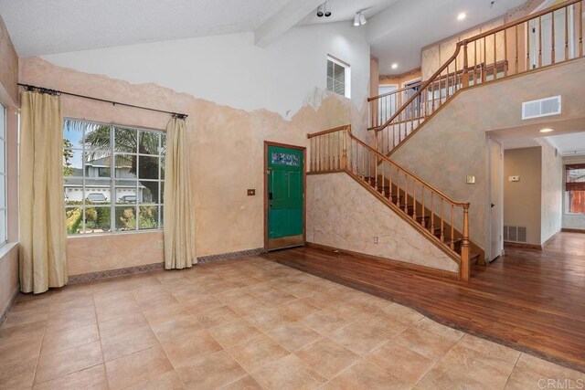 4556 Mariners Bay, Oceanside, CA 92057 - entryway featuring high vaulted ceiling, stairs, beam ceiling, and wood finished floors