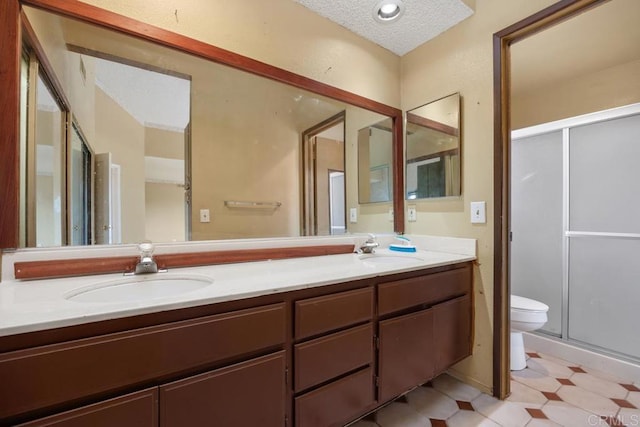 4556 Mariners Bay, Oceanside, CA 92057 - full bathroom with double vanity, a stall shower, a textured ceiling, and tile patterned floors
