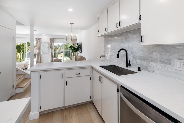 2340 Caringa Way Unit B, Carlsbad, CA 92009 - kitchen with stainless steel dishwasher, a peninsula, light countertops, white cabinetry, and recessed lighting