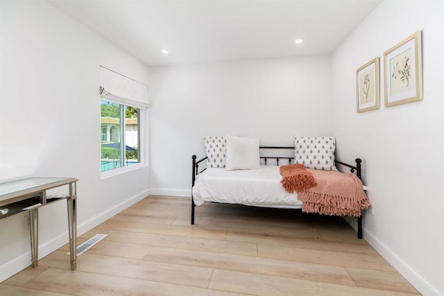 2340 Caringa Way Unit B, Carlsbad, CA 92009 - bedroom with wood finished floors and recessed lighting