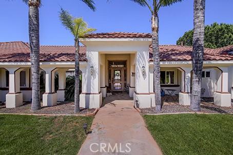 17470 Vanderhill Cir, Perris, CA 92570 - mediterranean / spanish house featuring a front yard, a tiled roof, and stucco siding
