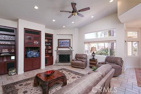 17470 Vanderhill Cir, Perris, CA 92570 - living area with recessed lighting, built in features, a fireplace, ceiling fan, and vaulted ceiling