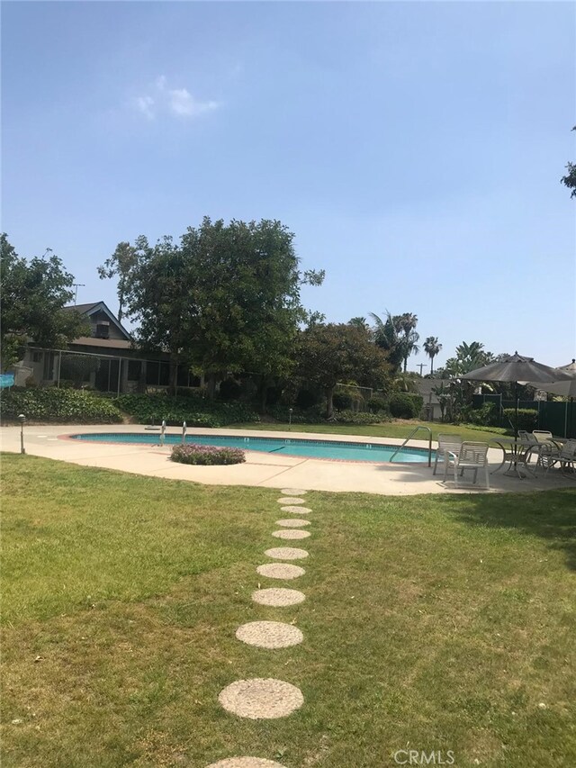 3666 Cedar Ave, Long Beach, CA 90807 - community pool featuring a lawn and a patio area