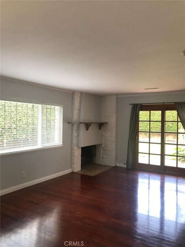 3666 Cedar Ave, Long Beach, CA 90807 - unfurnished living room with a stone fireplace and wood finished floors