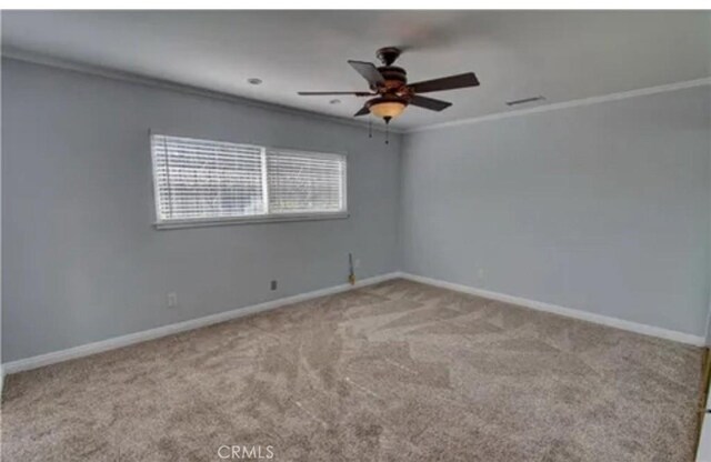 3666 Cedar Ave, Long Beach, CA 90807 - carpeted spare room featuring ornamental molding and ceiling fan