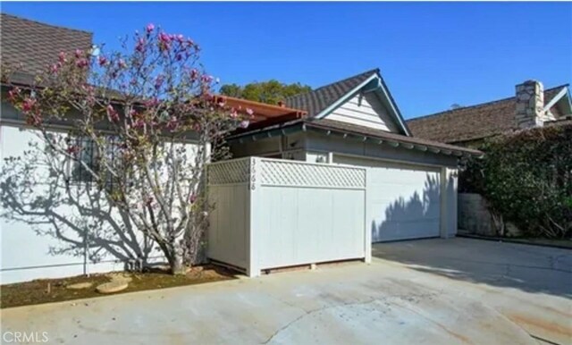 3666 Cedar Ave, Long Beach, CA 90807 - view of home's exterior featuring concrete driveway and a garage