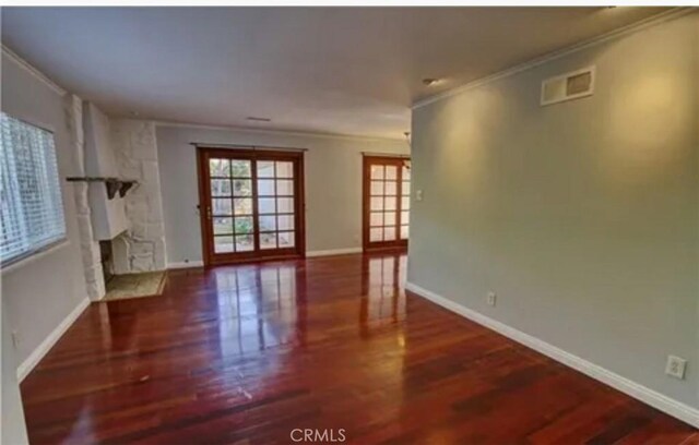 3666 Cedar Ave, Long Beach, CA 90807 - unfurnished living room featuring ornamental molding, wood finished floors, and a fireplace