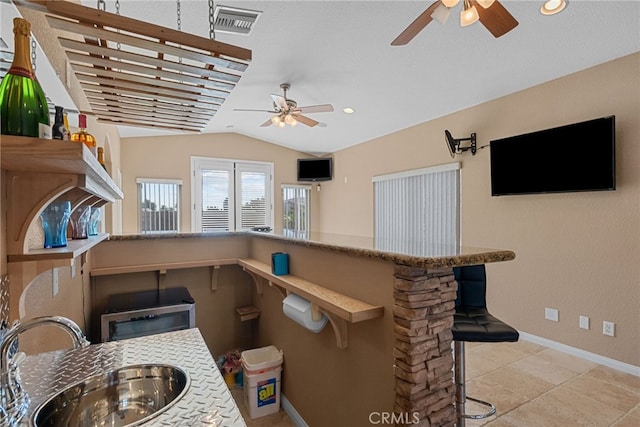 40139 15th St W, Palmdale, CA 93551 - kitchen with ceiling fan, vaulted ceiling, open shelves, light tile patterned flooring, and recessed lighting