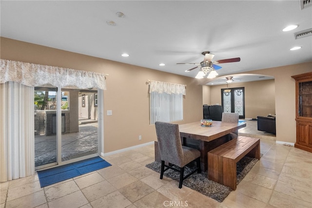 40139 15th St W, Palmdale, CA 93551 - dining area featuring a ceiling fan, arched walkways, recessed lighting, and stone tile flooring