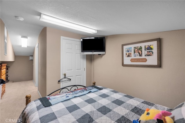 40139 15th St W, Palmdale, CA 93551 - bedroom featuring light colored carpet, a textured ceiling, and a closet