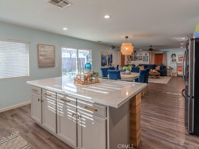 3031 E Lingard St, Lancaster, CA 93535 - kitchen featuring freestanding refrigerator, open floor plan, ceiling fan, recessed lighting, and dark wood-style floors