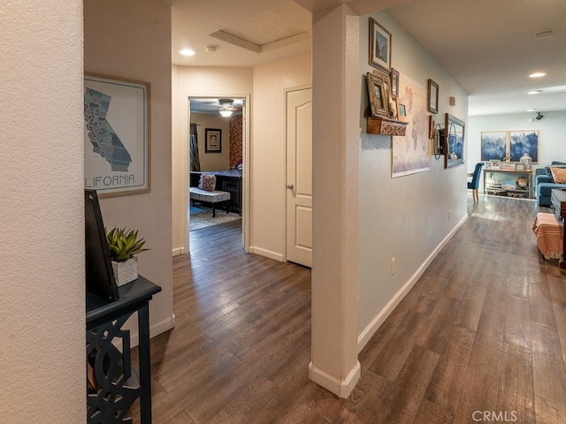 3031 E Lingard St, Lancaster, CA 93535 - corridor featuring dark wood-style floors, recessed lighting, and attic access