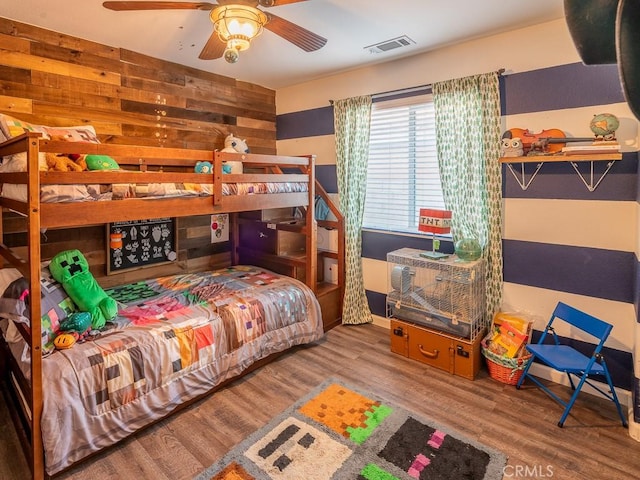 3031 E Lingard St, Lancaster, CA 93535 - bedroom featuring wood finished floors and wooden walls