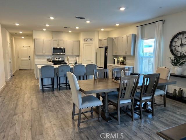 1658 Almondwood Dr, Orland, CA 95963 - dining area featuring wood finished floors and recessed lighting