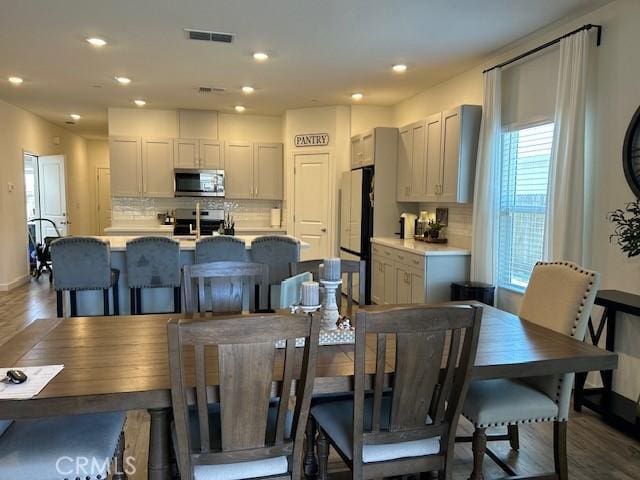 1658 Almondwood Dr, Orland, CA 95963 - dining space featuring dark wood-style flooring and recessed lighting