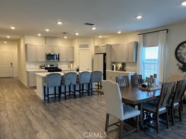 1658 Almondwood Dr, Orland, CA 95963 - dining area featuring wood finished floors and recessed lighting