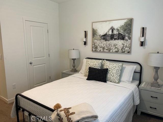 1658 Almondwood Dr, Orland, CA 95963 - bedroom with dark carpet and baseboards