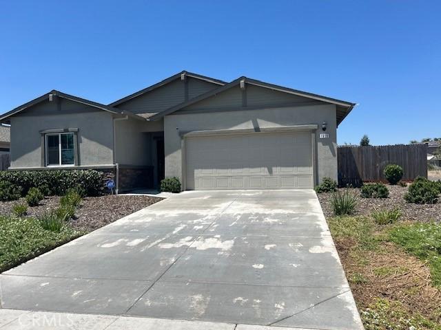 1658 Almondwood Dr, Orland, CA 95963 - single story home with an attached garage, stucco siding, and driveway