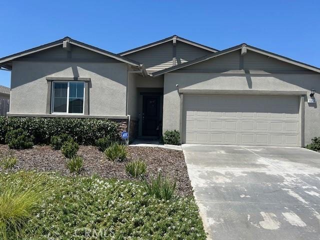 1658 Almondwood Dr, Orland, CA 95963 - single story home featuring stucco siding, an attached garage, and driveway