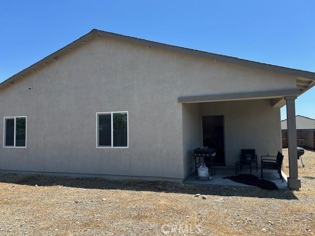 1658 Almondwood Dr, Orland, CA 95963 - rear view of property featuring a patio and stucco siding