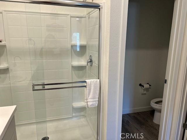 1658 Almondwood Dr, Orland, CA 95963 - full bathroom featuring a shower stall, vanity, and wood finished floors