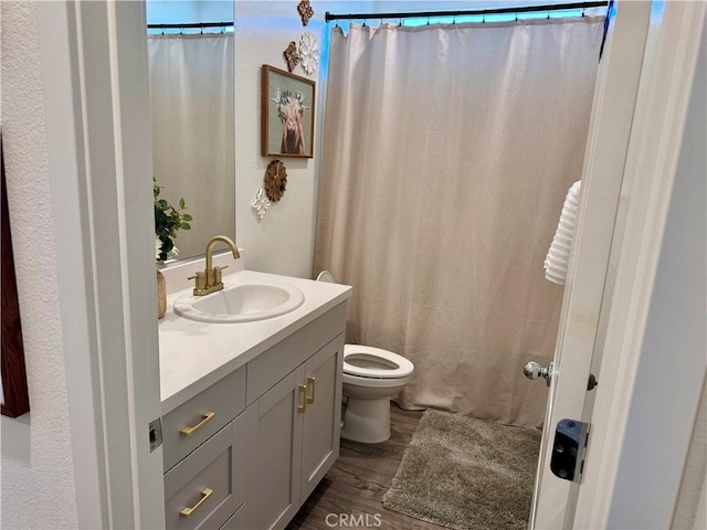 1658 Almondwood Dr, Orland, CA 95963 - bathroom with vanity, wood finished floors, and a shower with curtain