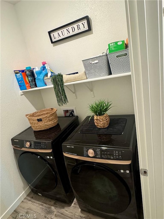 1658 Almondwood Dr, Orland, CA 95963 - laundry area featuring washer and clothes dryer and wood finished floors