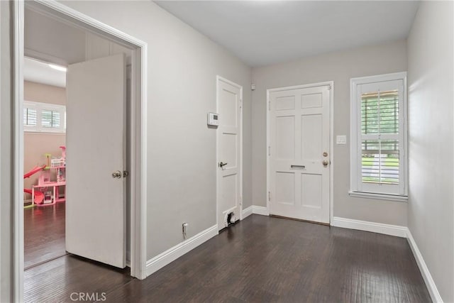 9548 Orizaba Ave, Downey, CA 90240 - entrance foyer featuring dark wood-style floors and baseboards
