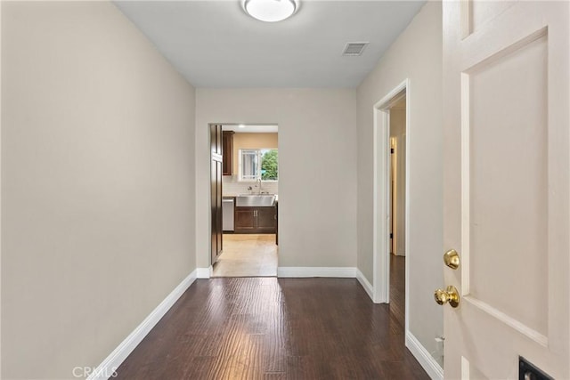 9548 Orizaba Ave, Downey, CA 90240 - hallway with wood finished floors and a sink