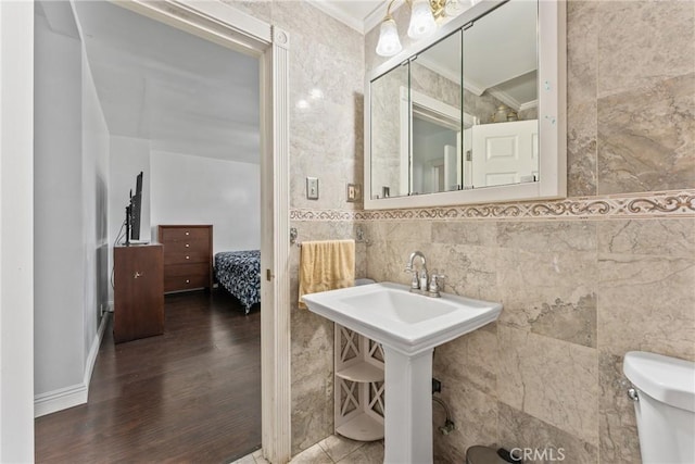 9548 Orizaba Ave, Downey, CA 90240 - bathroom with crown molding, tile walls, and wood finished floors