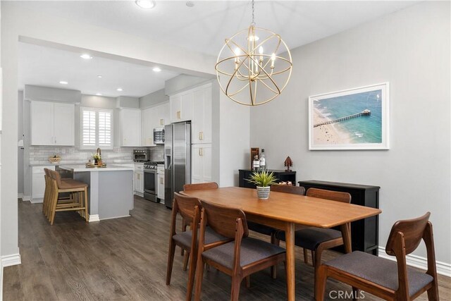 13131 Park Pl Unit 102, Hawthorne, CA 90250 - dining room featuring a chandelier, dark wood-style flooring, and recessed lighting