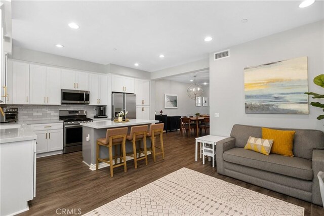 13131 Park Pl Unit 102, Hawthorne, CA 90250 - living room featuring dark wood finished floors and recessed lighting