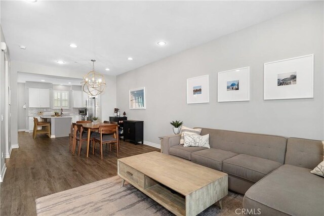 13131 Park Pl Unit 102, Hawthorne, CA 90250 - living room featuring a chandelier, dark wood-type flooring, and recessed lighting
