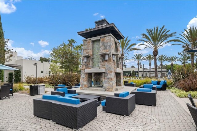 13131 Park Pl Unit 102, Hawthorne, CA 90250 - view of patio with an outdoor living space with a fireplace