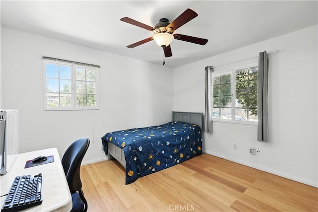 30156 Lexington Dr, Castaic, CA 91384 - bedroom featuring wood finished floors, a desk, and ceiling fan