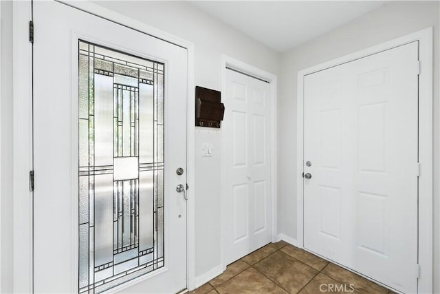 30156 Lexington Dr, Castaic, CA 91384 - entrance foyer featuring dark tile patterned flooring and baseboards