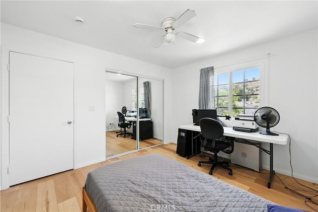 30156 Lexington Dr, Castaic, CA 91384 - bedroom with an office area, light wood-style flooring, a closet, and ceiling fan